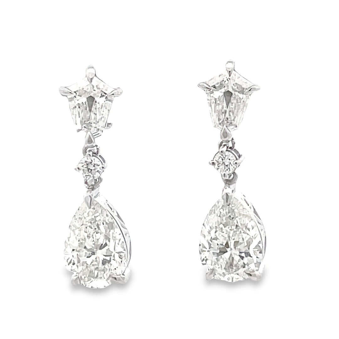 Dangling pear shape earrings in 18K WG with step cut kite shapes and GIA certified H/SI2 pear shape diamonds.  D6.54ct.t.w.