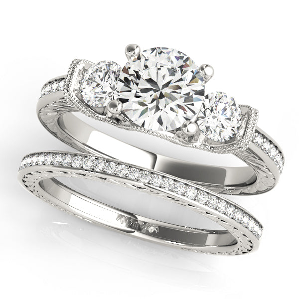 ENGAGEMENT RINGS 3 STONE ROUND